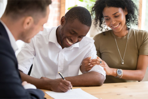 Couple signing on a loan